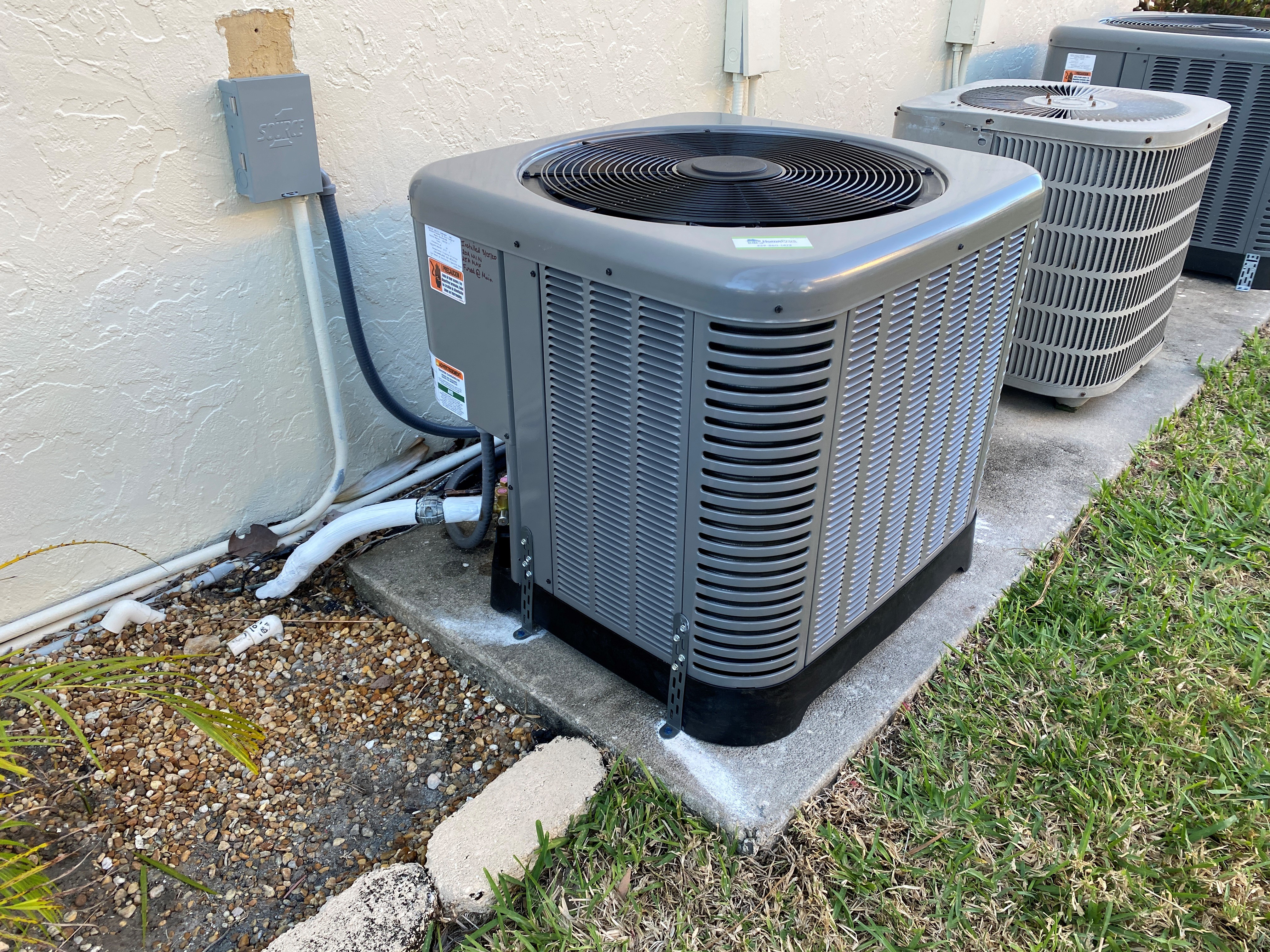 New outdoor AC condenser unit installed by HomePros in Southwest Florida