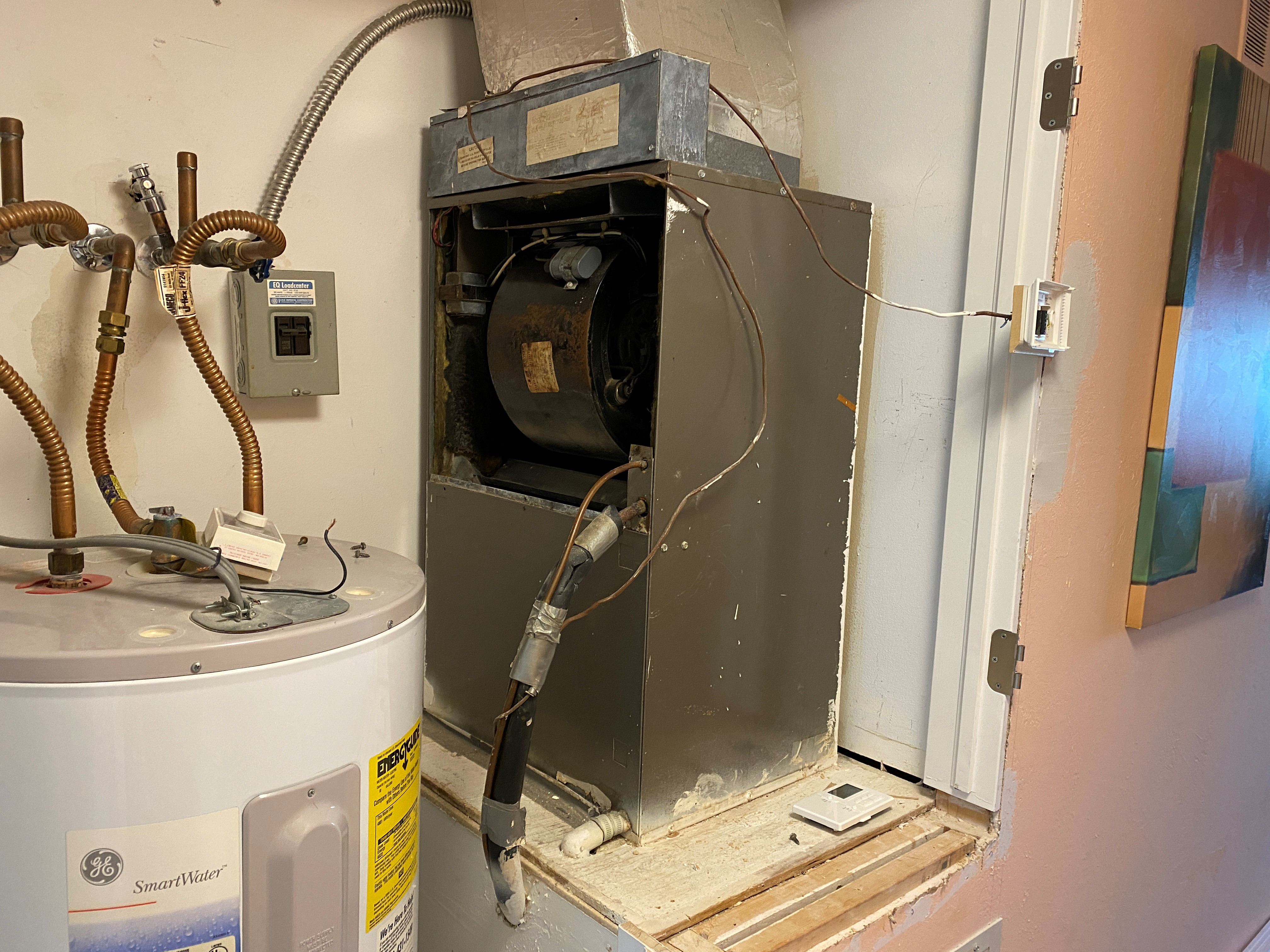 Old worn air handler before replacement by HomePros in Southwest Florida