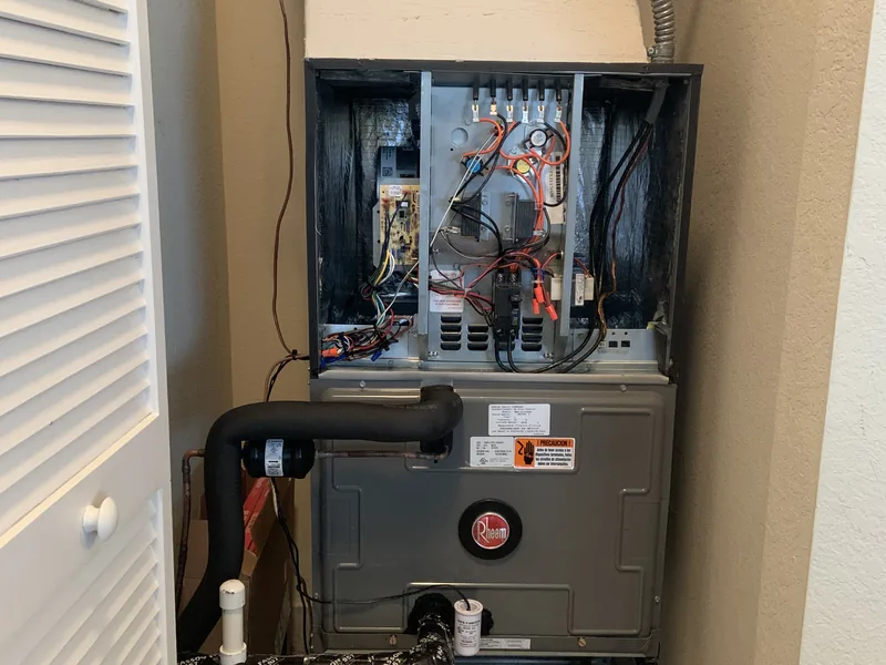 HomePros technician work on AC electrical components